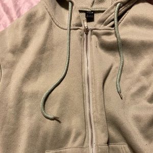 Slightly worn green oversized hoodie drawstring